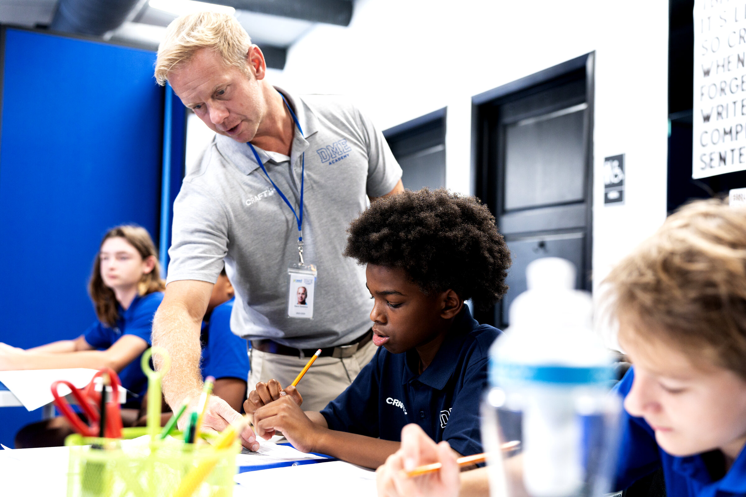 DME Academy teacher providing one-on-one instruction to student